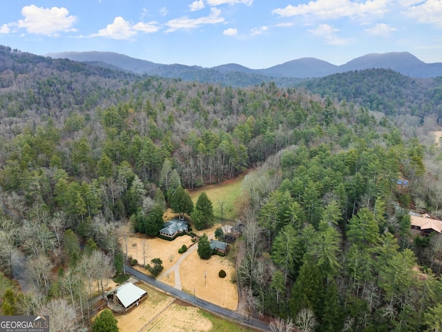 bird's eye view featuring a mountain view and a wooded view