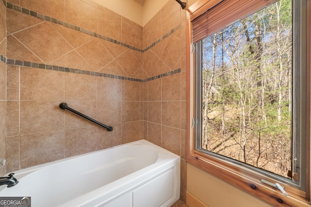 full bathroom with a tub