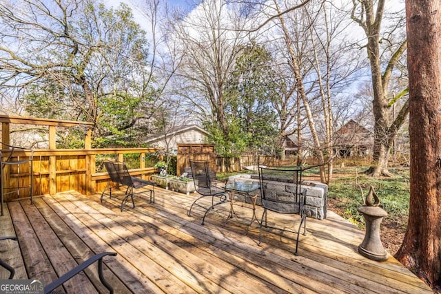 wooden terrace with outdoor dining area