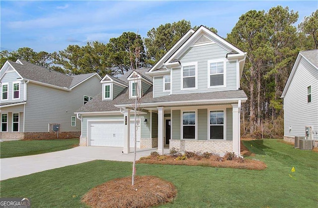 view of front facade with covered porch, concrete driveway, a front lawn, and a garage