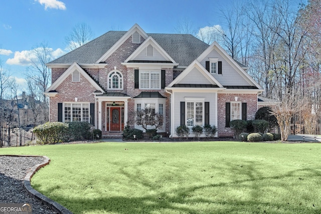 view of front of house with a front lawn, a standing seam roof, and brick siding