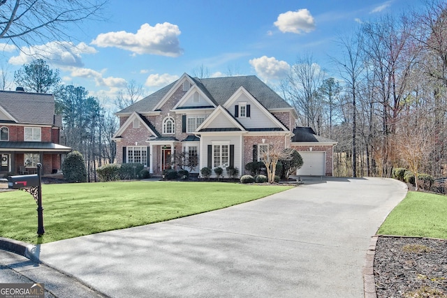 view of front of property featuring a front yard, brick siding, driveway, and an attached garage