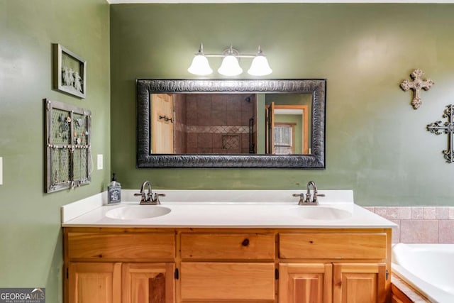 bathroom featuring a garden tub, a sink, and double vanity