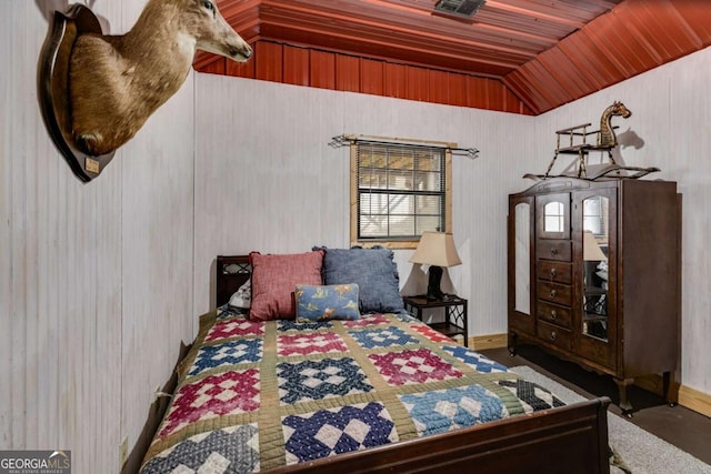 bedroom with vaulted ceiling and wooden ceiling