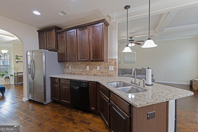 kitchen featuring dark wood finished floors, hanging light fixtures, a sink, dark brown cabinets, and dishwasher