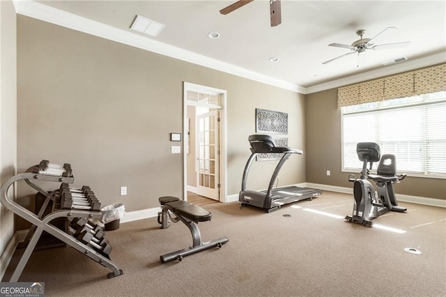 exercise room featuring baseboards, visible vents, ceiling fan, and crown molding