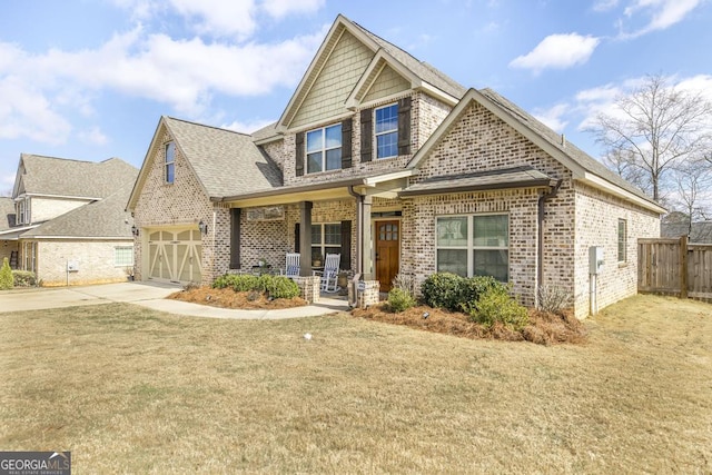 craftsman-style house featuring a porch, brick siding, fence, concrete driveway, and a front yard