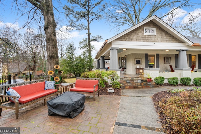 exterior space with an outdoor living space and fence