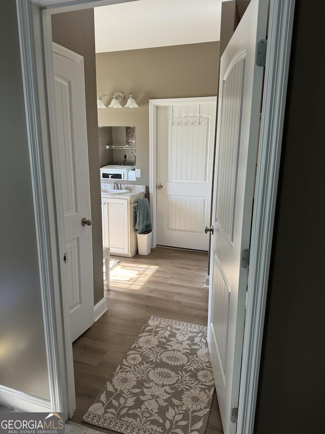 hall with light wood-style flooring