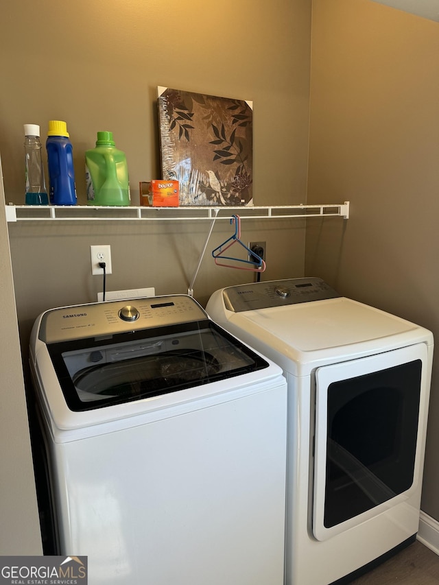 laundry room with laundry area and separate washer and dryer