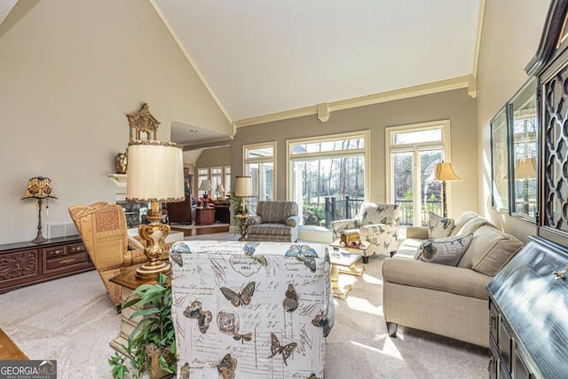 carpeted living area with high vaulted ceiling and ornamental molding