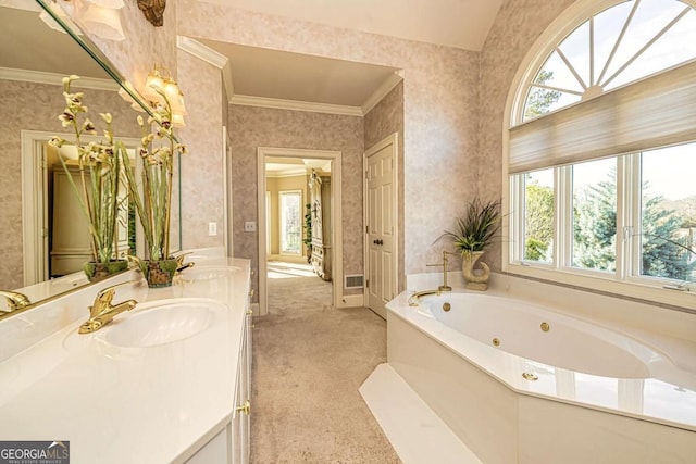 bathroom with wallpapered walls, a tub with jets, and vanity