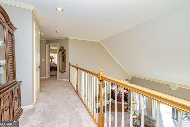 corridor with baseboards, ornamental molding, recessed lighting, and light colored carpet