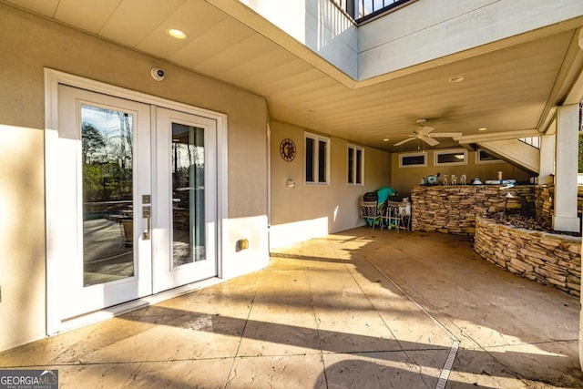 view of patio featuring french doors and a ceiling fan