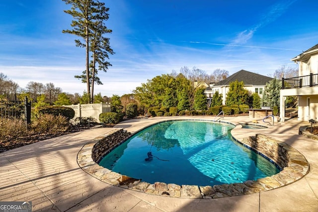 view of pool with a patio area, fence, and a fenced in pool