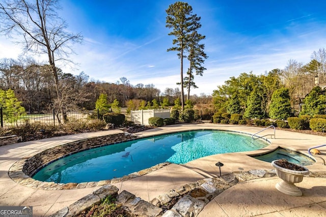 view of swimming pool with a fenced in pool, a patio area, and fence