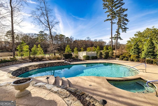 view of swimming pool featuring a patio, fence, and a fenced in pool