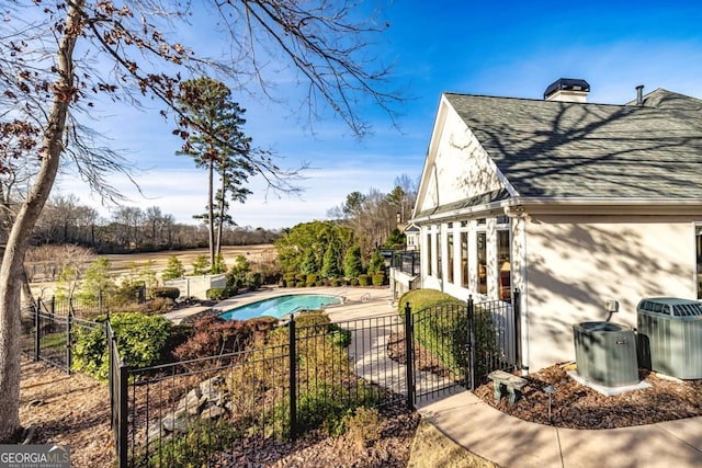 exterior space with fence, a fenced in pool, and a patio