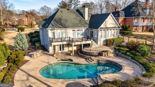 rear view of property with a patio, an in ground hot tub, fence, stairs, and stucco siding