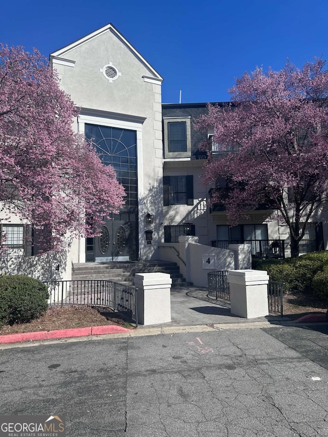 view of property featuring a fenced front yard