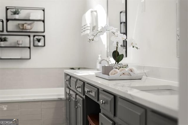 full bath featuring a sink and a washtub