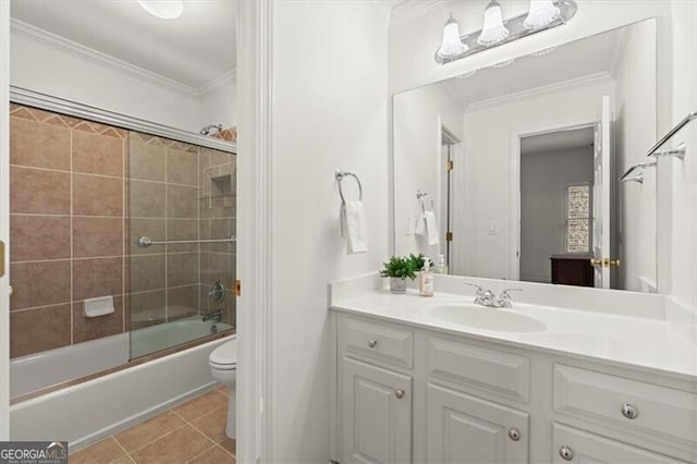 bathroom featuring toilet, shower / bath combination with glass door, ornamental molding, tile patterned floors, and vanity