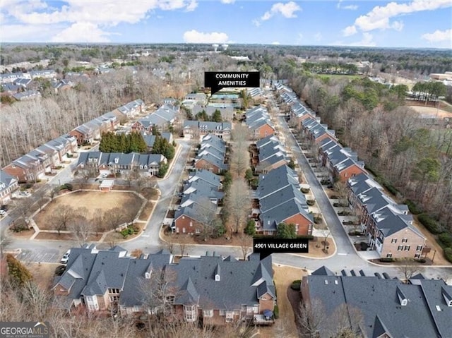 birds eye view of property with a residential view