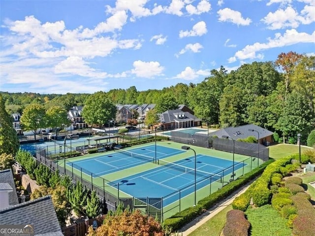 view of tennis court with fence