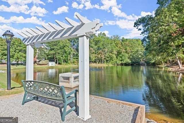 dock area with a water view and a pergola