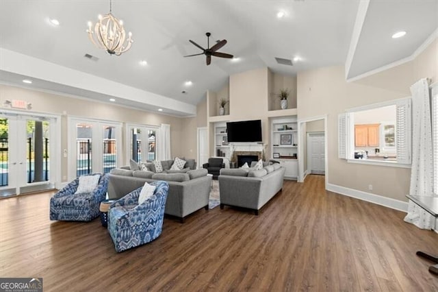 living room with high vaulted ceiling, a fireplace, wood finished floors, baseboards, and french doors