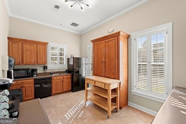 kitchen with plenty of natural light, visible vents, brown cabinetry, ornamental molding, and black appliances