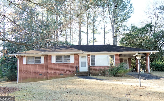 single story home with a front yard, crawl space, and brick siding