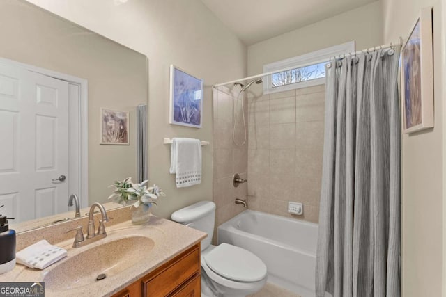 bathroom with toilet, shower / bath combo with shower curtain, and vanity