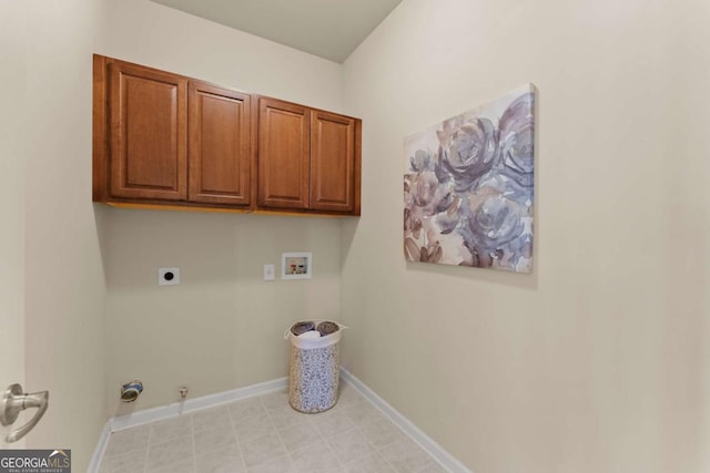 laundry area with cabinet space, baseboards, hookup for a gas dryer, hookup for an electric dryer, and washer hookup