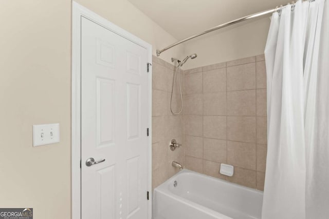 full bathroom with shower / bath combo with shower curtain