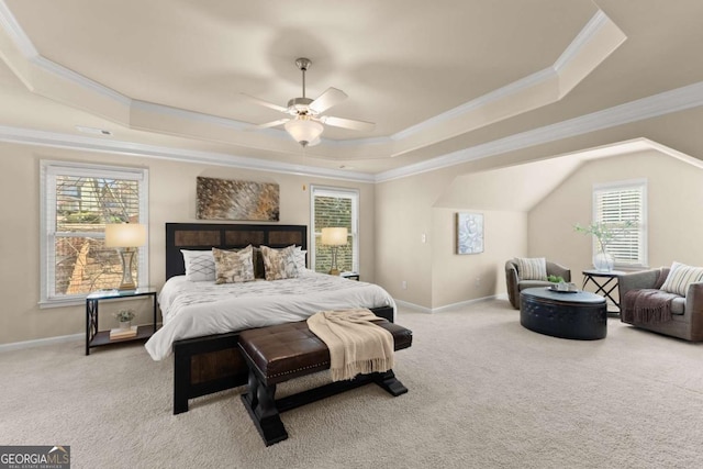 carpeted bedroom with crown molding, a raised ceiling, and baseboards