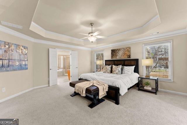 bedroom featuring a raised ceiling, visible vents, ornamental molding, light carpet, and baseboards