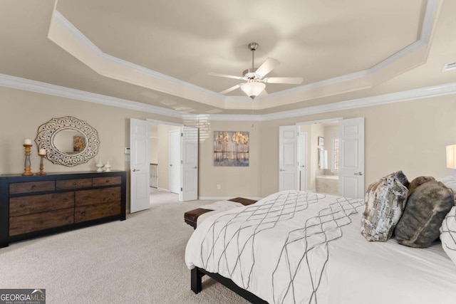 bedroom with light carpet, visible vents, a raised ceiling, ensuite bathroom, and crown molding