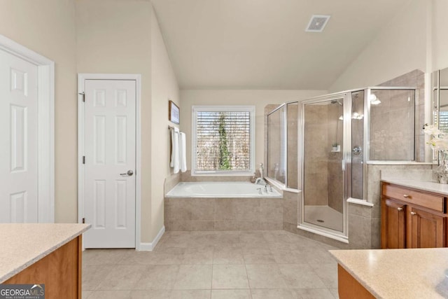 full bath featuring lofted ceiling, a stall shower, vanity, tile patterned flooring, and a bath