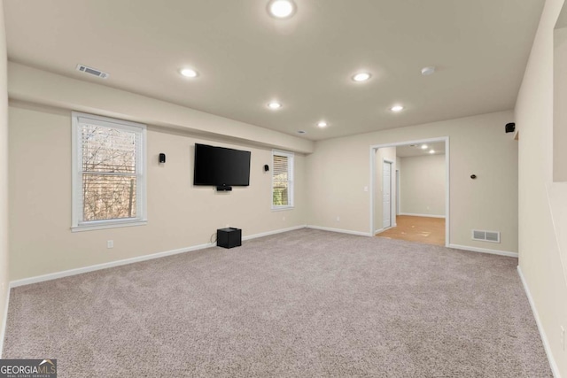 interior space with recessed lighting, visible vents, and light colored carpet