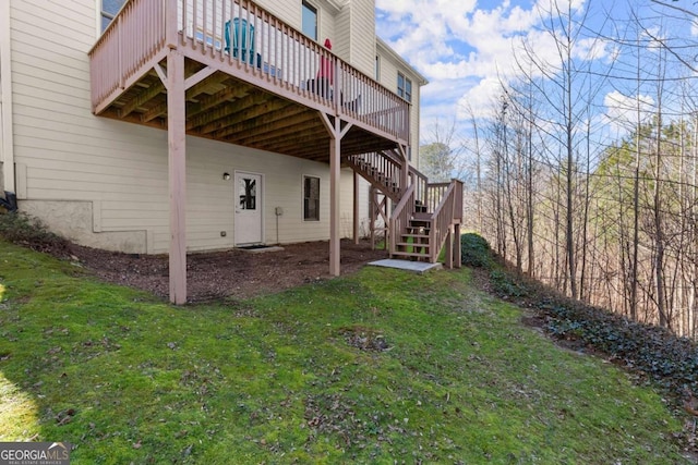 view of property exterior featuring a deck, a yard, and stairway