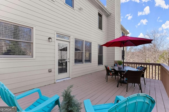 deck with outdoor dining area