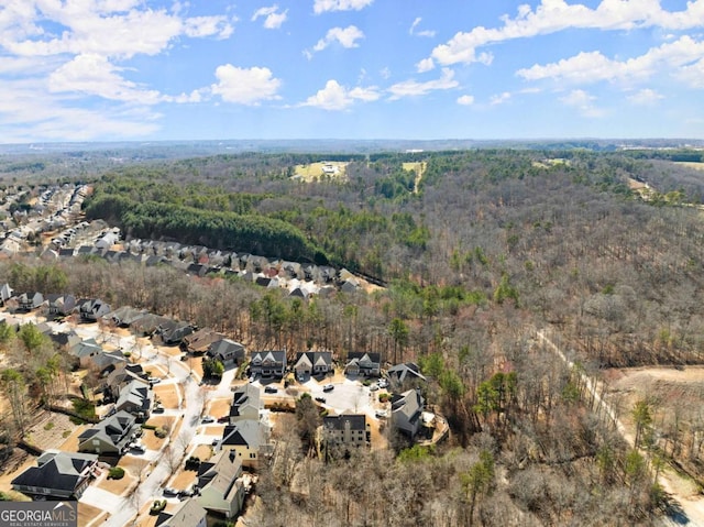 bird's eye view with a forest view and a residential view