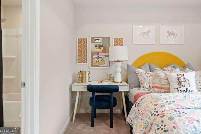 bedroom with carpet floors and baseboards