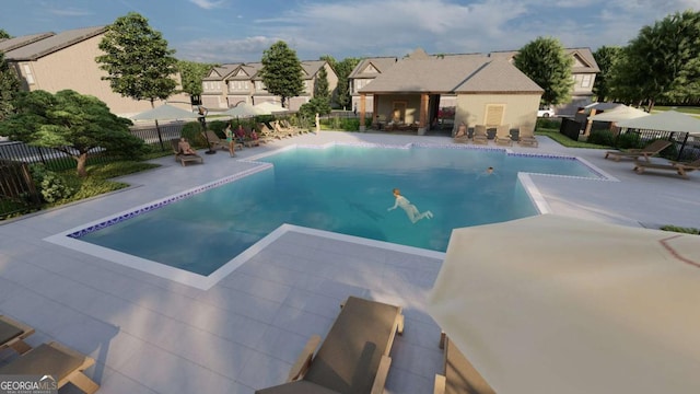 view of pool with a residential view, fence, a fenced in pool, and a patio