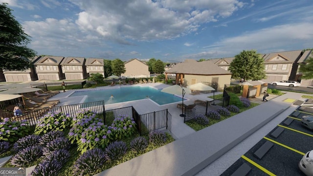 community pool with a residential view and fence