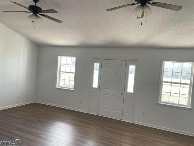 714 E Simon St, Glennville, GA 30427 - entrance foyer with ceiling fan, a textured ceiling, dark wood-style floors, and baseboards