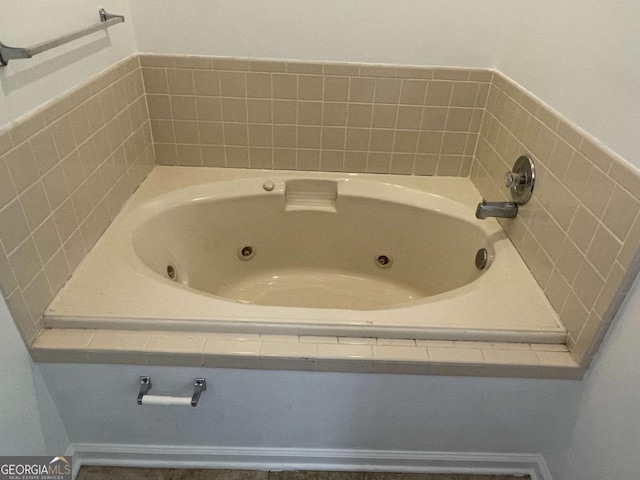 full bath featuring a tub with jets