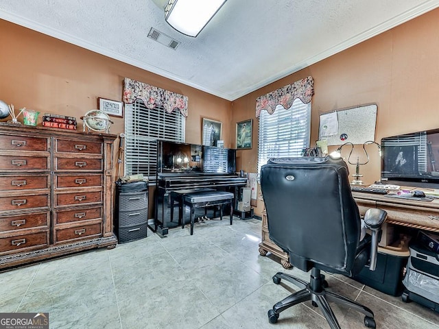 office with light tile patterned floors, visible vents, a textured ceiling, and ornamental molding