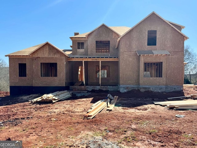 property in mid-construction with stucco siding